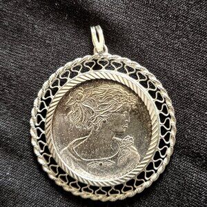 1/4 Ounce .999 Fine Silver Coin Pendant with Intricate Filigree Frame